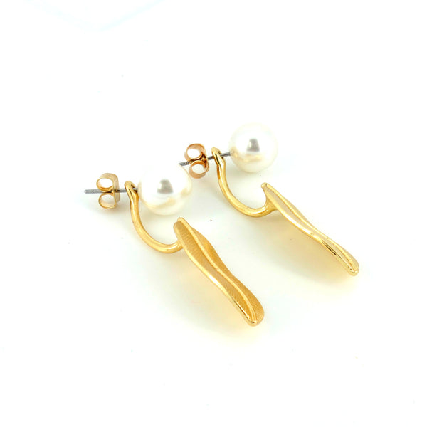 Gold earrings on a white background
