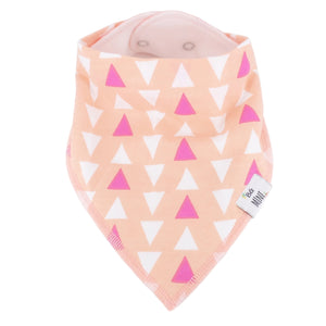 Baby bib with pink and white triangle pattern on a peach background