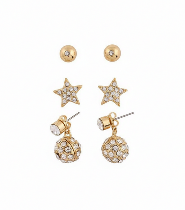 Set of gold earrings including star-shaped and ball designs on a white background