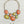 Charger l'image dans la galerie, A statement necklace with large orange and yellow agate-like stones in silver-toned settings, shown with matching small yellow dangle earrings on a dark textured surface.
