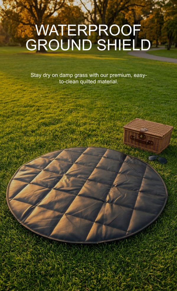 Round waterproof ground shield on grass with a picnic basket in the background