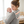 Load image into Gallery viewer, Woman holding a baby in a room with a crib in the background
