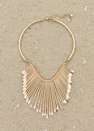 Uniklook gold ray Boho statement necklace on the sand