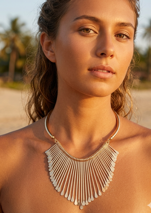 sun tanned gil weras a gold ray statement necklace