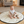 Load image into Gallery viewer, Baby sitting on a round play mat in a living room with toys around
