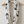 Load image into Gallery viewer, White infinity scarf with black anchor patterns draped over a wooden hanger on a white background.
