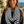 Load image into Gallery viewer, Woman wearing a black and white striped scarf with a scenic background
