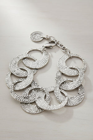 A silver-toned textured link bracelet featuring overlapping oval links connected by a chain and lobster clasp, shown on a plain white background.