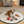 Load image into Gallery viewer, Dog lying on a round mat with toys in a cozy living room.
