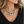 Load image into Gallery viewer, Burnished silver rose necklace worn with a black knit top, lifestyle photo
