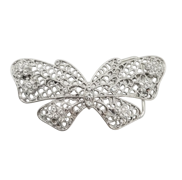 A silver butterfly-shaped brooch or hair pin with intricate filigree detailing and clear rhinestone embellishments, shown on a plain light gray background.
