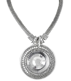 Silver necklace with a round pendant on a white background