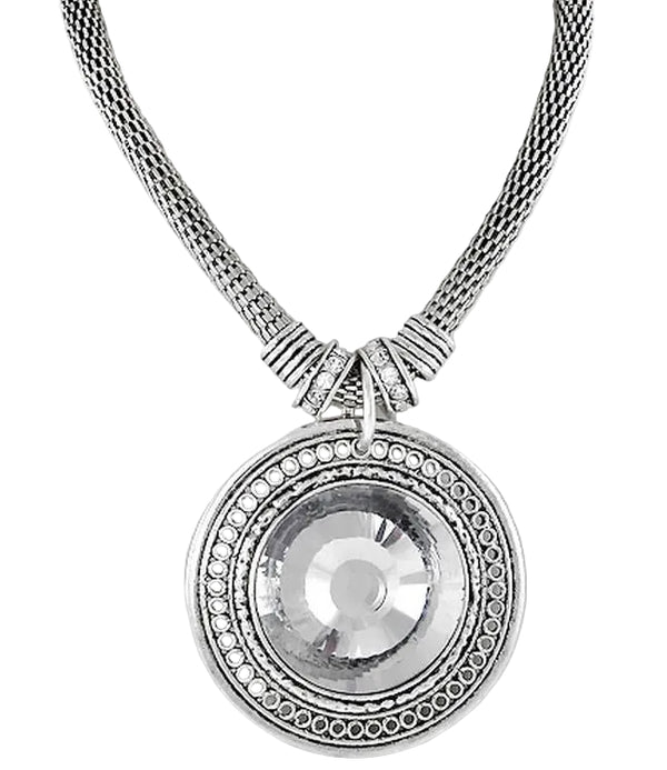 Silver necklace with a round pendant on a white background