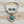 Load image into Gallery viewer, A sterling silver Southwestern-style jewelry set featuring a collar necklace and matching drop earrings, both adorned with round turquoise stones, displayed on a light wood background.
