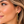 Load image into Gallery viewer, Woman wearing green and amber floral crystal earrings
