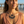 Load image into Gallery viewer, Woman wearing a layered necklace on a beach
