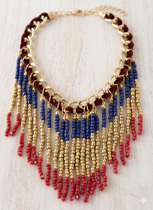 Beaded necklace with red, blue, and gold beads on a light wooden surface