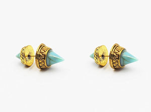 Pair of gold and turquoise spike earrings on a white background