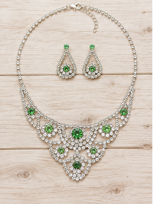 Green crystal necklace and earrings on pale barn wood