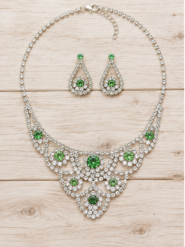 Green crystal necklace and earrings on pale barn wood