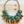 Charger l'image dans la galerie, Colorful beaded necklace on a wooden surface
