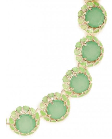 A close-up of a gold chain bracelet featuring oval light green cabochon center stones surrounded by small round green stones in gold settings, shown against a plain white background.