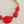Load image into Gallery viewer, Necklace with red teardrop-shaped pendants on a dark surface
