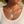 Charger l'image dans la galerie, A close-up of a woman wearing a layered silver necklace set. The top layer is a delicate chain with a small silver key-shaped charm, while the bottom layer is a thicker chain with a rectangular dog tag pendant engraved with the words 'BE BRAVE &amp; KEEP GOING'.
