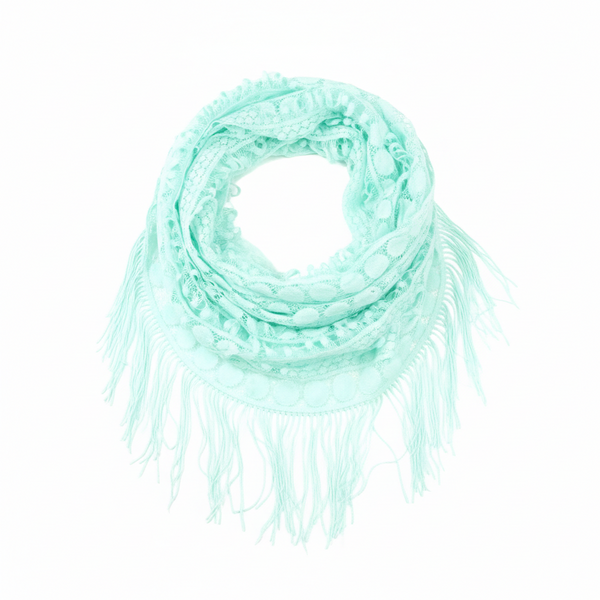 Mint green scarf with fringe on a white background