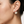 Load image into Gallery viewer, Close-up of a person wearing pearl earrings with a neutral background
