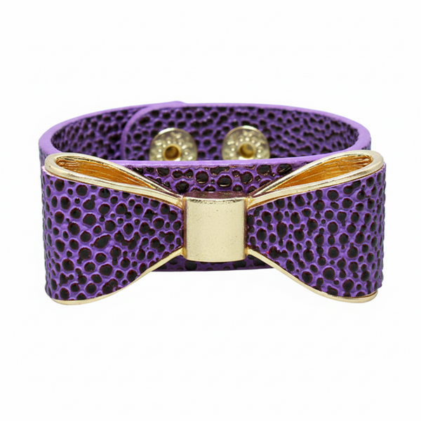 Purple textured bracelet with gold accents on a white background