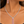 Load image into Gallery viewer, Red and clear crystal necklace and matching earrings worn by a woman
