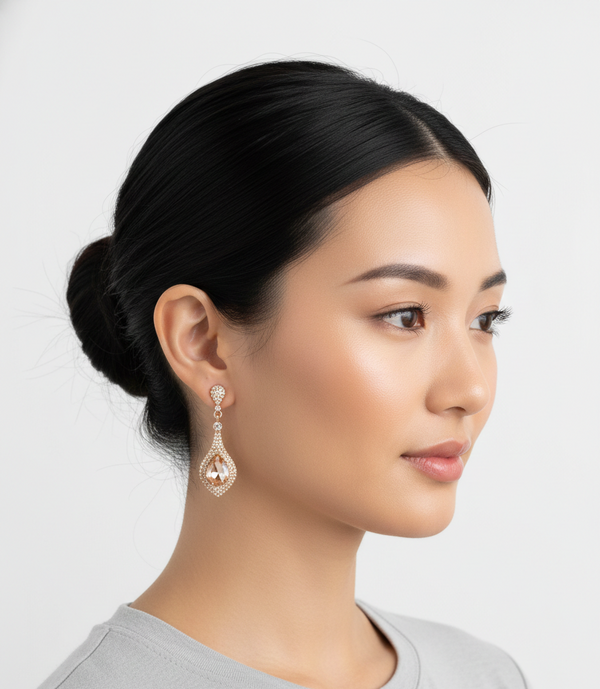 Woman wearing a diamond earring on a white background