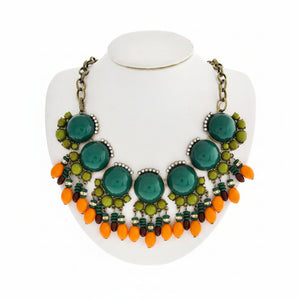 Jewelry set with necklace and earrings on a white stand