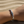 Load image into Gallery viewer, Silver bracelet with arrow design on a wrist against a sandy background
