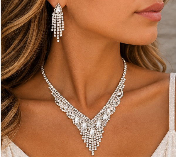 Silver crystal necklace and earrings worn by model