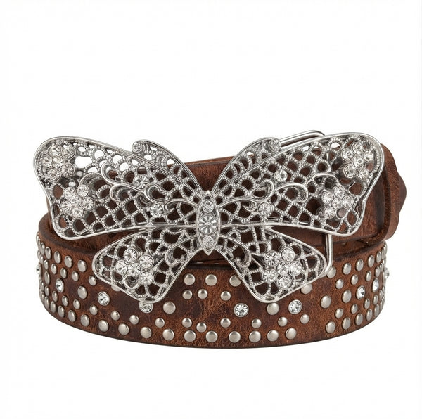 A brown leather belt featuring a large silver butterfly filigree buckle embellished with rhinestones, and the belt itself decorated with silver studs.