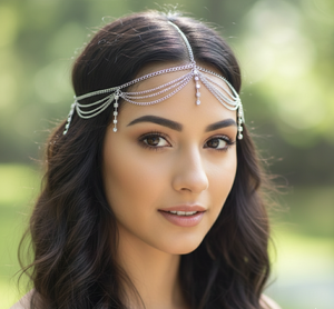 Woman wearing a decorative headpiece with a blurred green background
