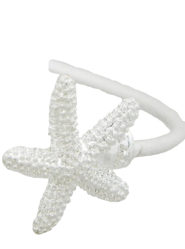 Star-shaped silver earring on a white background