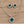 Charger l'image dans la galerie, Teal heart necklace and clip-on earrings on pale barn wood
