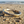 Load image into Gallery viewer, Decorative bracelet on a sandy beach with ocean in the background
