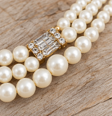 Rhinestone connector and pearl strand detail