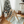Load image into Gallery viewer, Child standing next to a wooden climbing toy in a room with a decorated Christmas tree.

