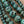 Charger l'image dans la galerie, Close-up turquoise green dark marbled round beads
