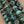 Charger l'image dans la galerie, Close-up mottled turquoise green bead texture
