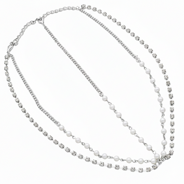 Two-layered necklace with pearls and crystals on a white background