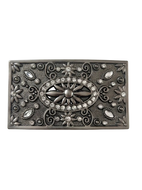 A rectangular silver-toned metal belt buckle featuring an ornate western-style floral and scroll pattern with clear rhinestone accents, shown on a plain light gray background.