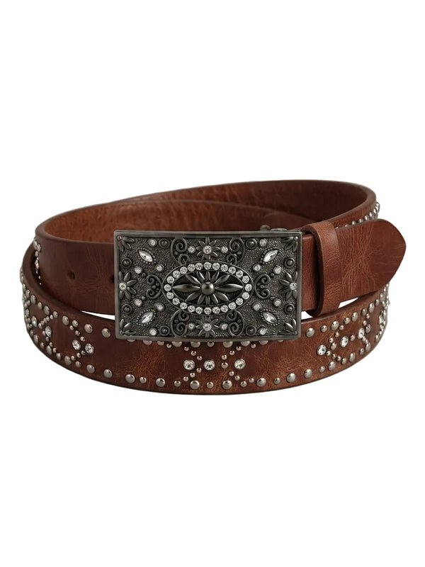 A brown leather belt with a large, ornate silver-tone metal buckle embellished with crystals, and the belt itself decorated with silver studs, coiled on a neutral gray background.