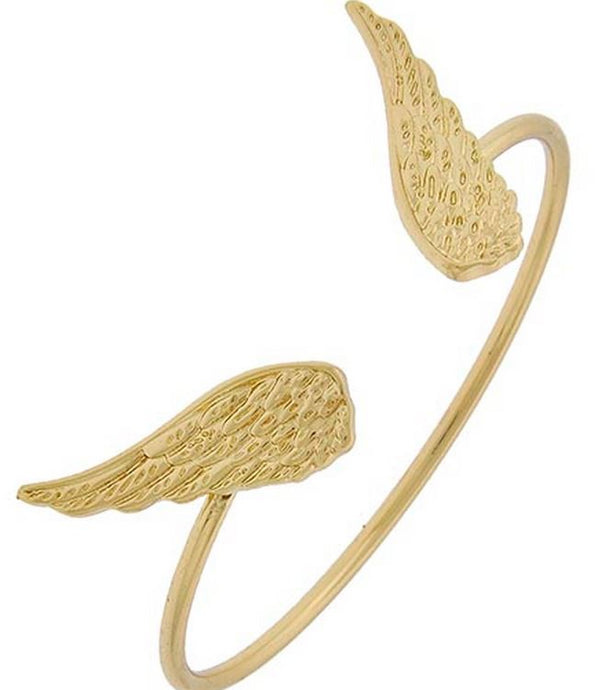 Gold wing-shaped bracelet on a white background