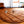 Load image into Gallery viewer, QUILTED MAT | 47&quot; | PUMPKIN + BLANC

